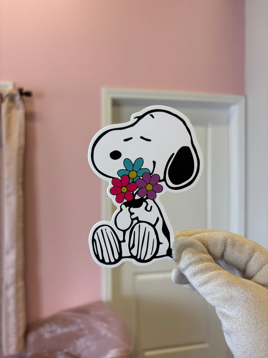 Snoopy hugging flowers 🌺