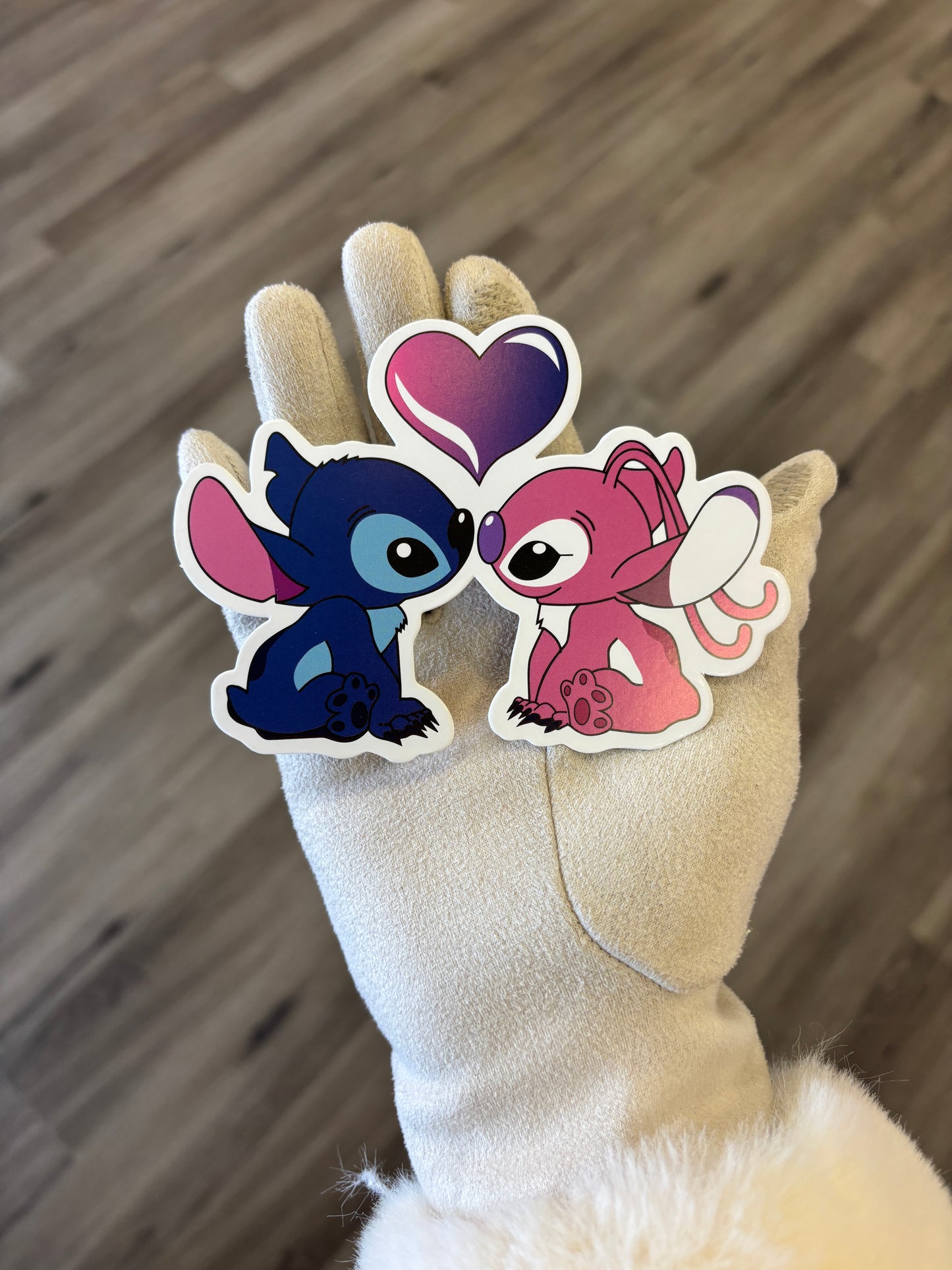 Stitch and angel forming heart 💙🩷