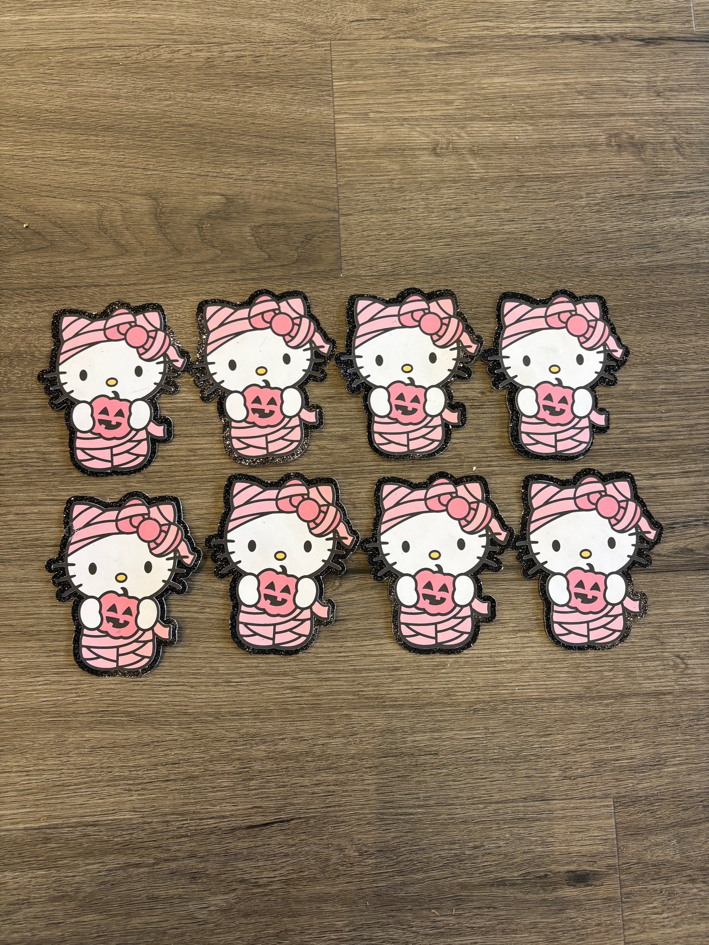 1Hello Kitty mummy with black glitter background