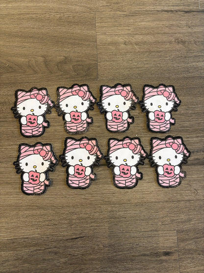 1Hello Kitty mummy with black glitter background