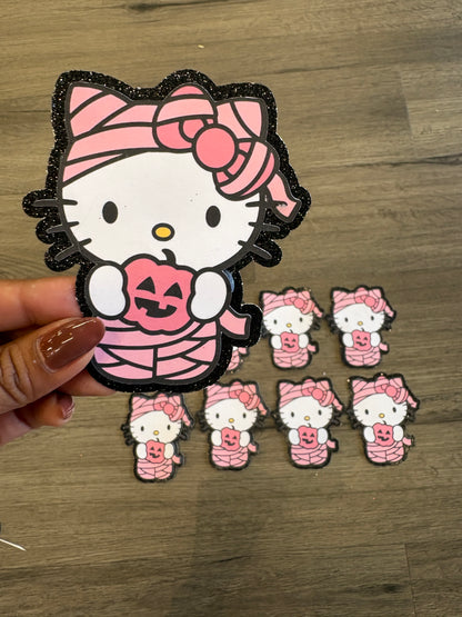 1Hello Kitty mummy with black glitter background