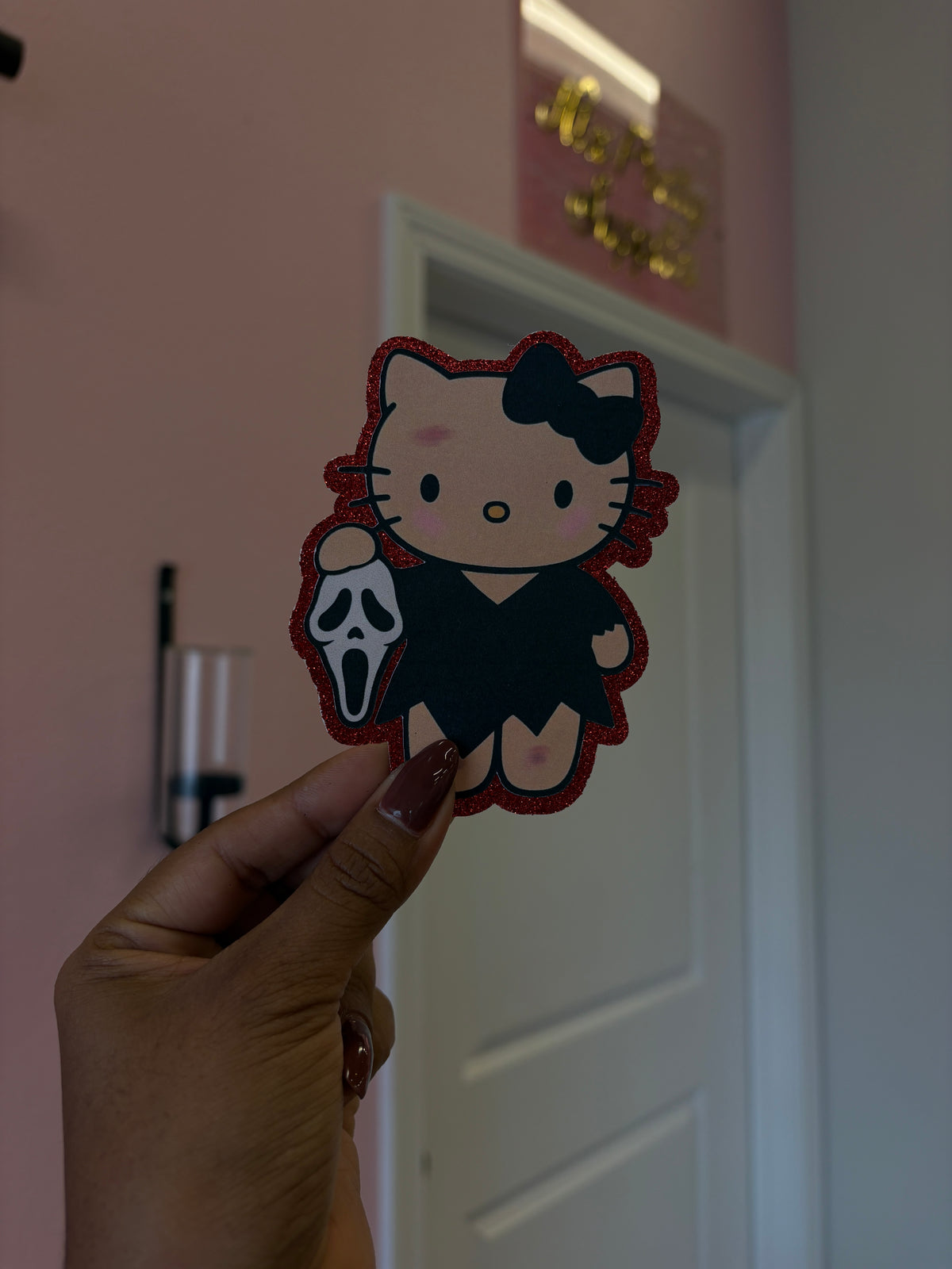1 Hello Kitty Ghostface mask with red glitter background