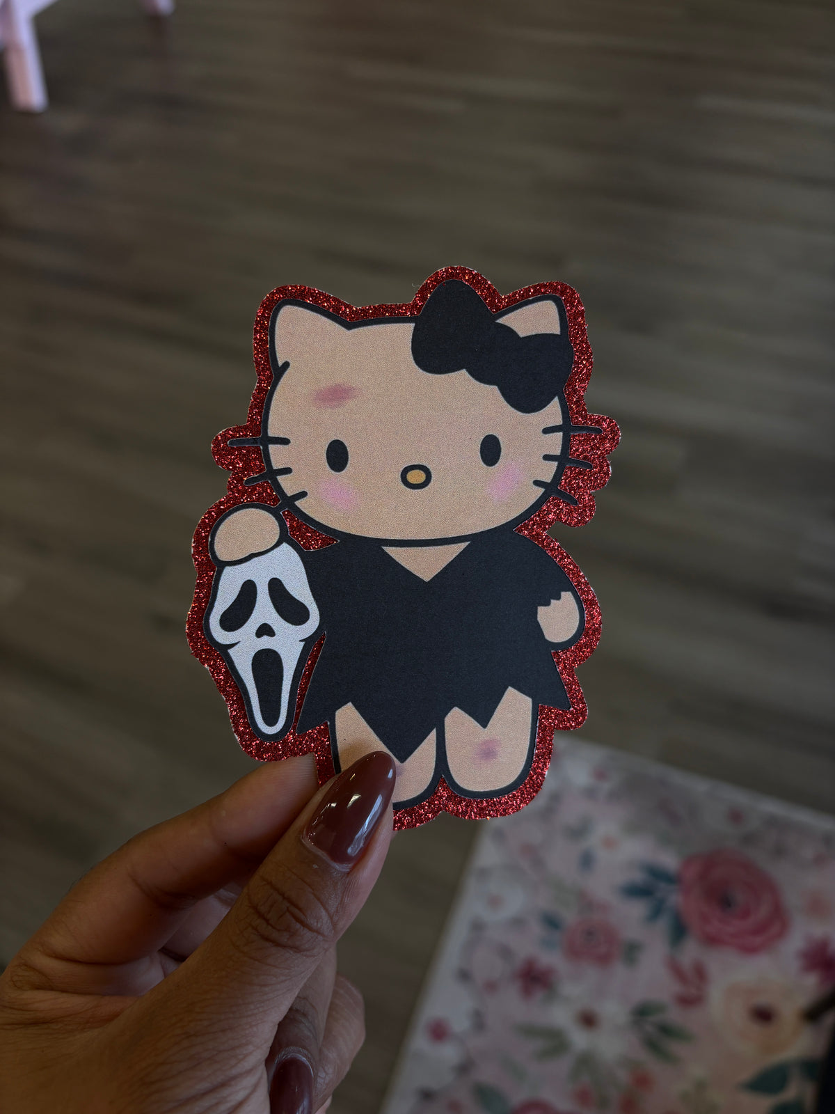 1 Hello Kitty Ghostface mask with red glitter background